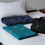 메카 방문을 위한 필수 가이드 - **Prompt 1: Preparation and Anticipation**
    "A serene indoor shot of a person, approximately 30-4...